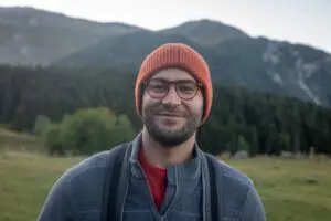 Smiling man with glasses in nature