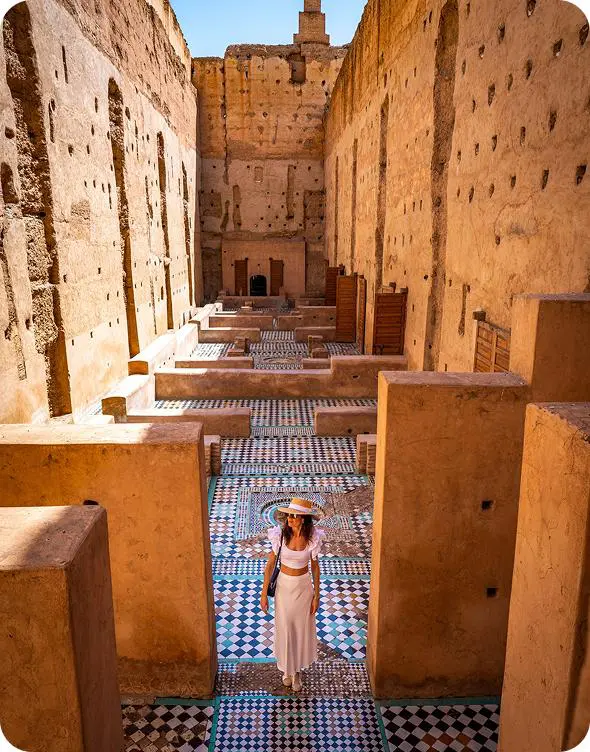 Woman exploring ancient architecture with tiled floors