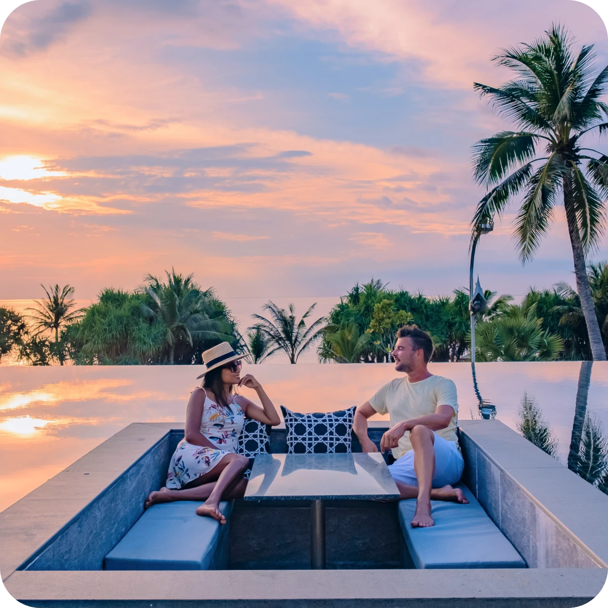 Sunset view with palm trees and couple