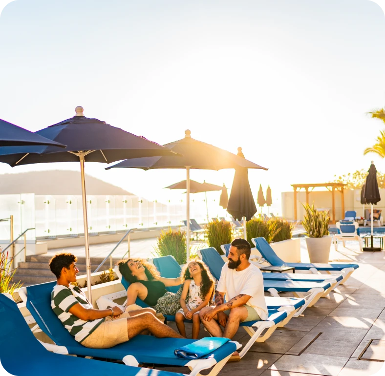 Group enjoying sunny day by pool