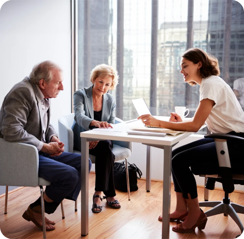 Three people discussing business plans