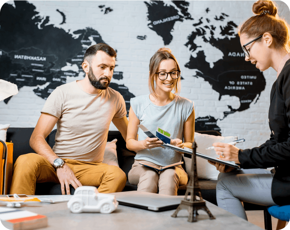Couple planning trip with travel agent